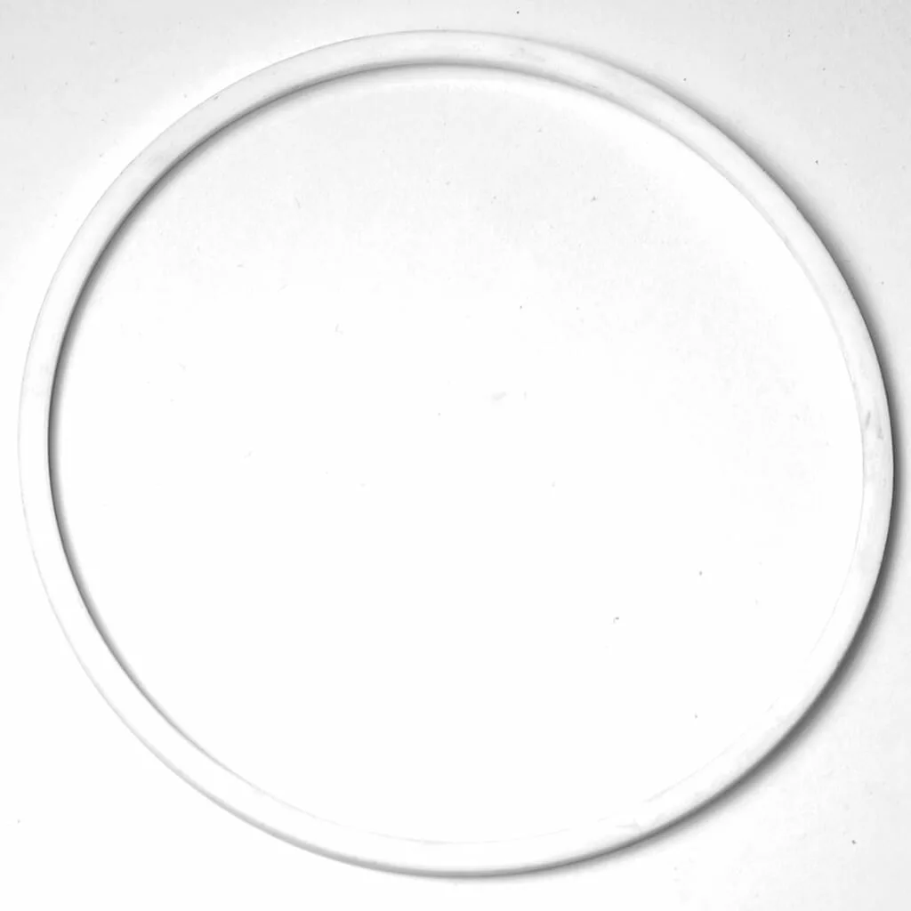 The SM.477 WATER BUTTON SUPPORT, a single white circular ring, rests flat on a plain white background for a simple and minimalistic look. © 2025 1st-line.com