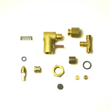 The SM.489 HANDLE and various brass and metal plumbing or mechanical components such as springs, fittings, nuts, washers, and small cylindrical parts are arranged neatly on a white background. © 2025 1st-line.com