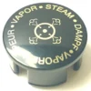 The SP.269 STEAM HANDLE LID is a black, circular cap featuring gold text—STEAM, DAMPF, VAPOR, VAPEUR—encircling a central steam cloud or skull-and-crossbones symbol. © 2025 1st-line.com