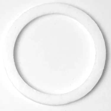 The SP.297 PTFE GASKET 50x40x2mm is shown lying flat on a white surface, viewed from above. This white gasket has a smooth texture and uniform thickness throughout. © 2025 1st-line.com