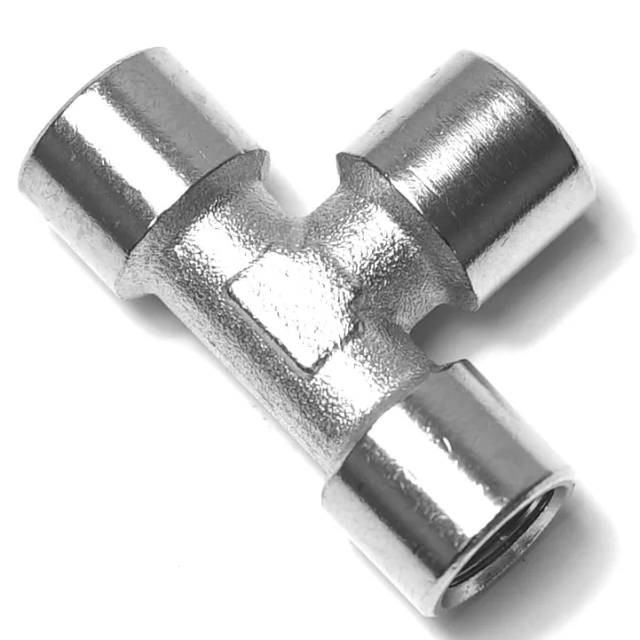 The V.1867 1/8F Elbow Fitting is a metallic T-shaped connector with threaded openings on all ends, ideal for securely joining three pipe sections at right angles. © 2025 1st-line.com