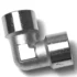 The V.1868 1/2F Elbow Fitting is a shiny metal piece with threaded openings on both ends, shown on a white background. © 2025 1st-line.com