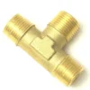 The V..900 3/8 T FITTING is a brass connector with three 3/8 threaded male ends, ideal for plumbing or gas line connections, shown isolated on a white background. © 2025 1st-line.com
