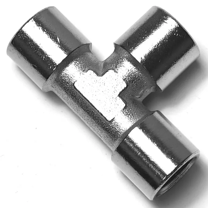 The V..902 1/4 FEMALE T-FITTING is a shiny, metallic connector with smooth surfaces for joining three pipes at right angles. © 2025 1st-line.com