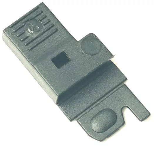 The V..927 90º Female Terminal Protector is a black, rectangular plastic cover with a central square hole, notched edge, textured lines on one end, flat base, and raised circular detail. © 2025 1st-line.com