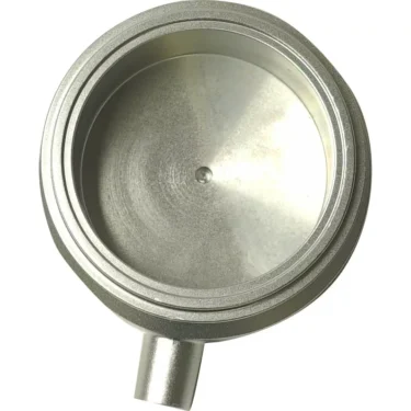 A close-up of the Caffemotive FMSET0002X75 Anodized Intermediate Sector, highlighting its circular design, smooth anodized surface, and a short spout at the bottom for espresso machine use. © 2025 1st-line.com