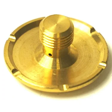 A close-up of the DISCONTINUED F..219 MICROSWITCH 250V 10A shows its round, gold-colored metal body with a threaded central shaft and four evenly spaced notches on the edge, used in 250V, 10A microswitch applications. © 2025 1st-line.com