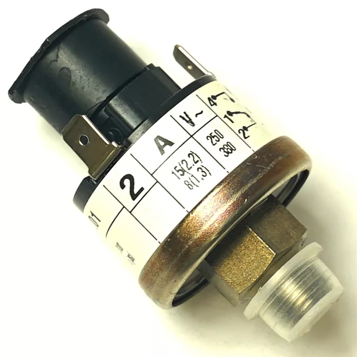 A close-up of the Gaggia Boiler Pressure Switch Jaeger 16.01, featuring a metal base, threaded connector, and labeled markings showing electrical specs and terminals—ideal for use in Gaggia Boiler or Jaeger 16.01 systems. © 2025 1st-line.com