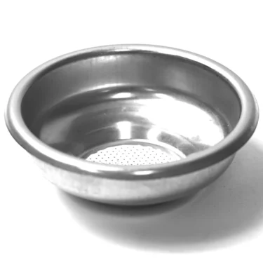 A close-up of the MZ.106 7GR 1 CUP FILTER BASKET, a metal portafilter basket with perforated holes for holding coffee grounds in an espresso machine, shown against a white background. © 2025 1st-line.com