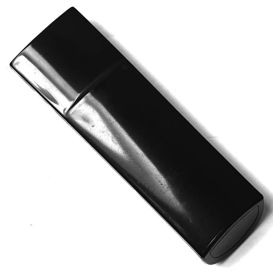 A closed GI.513 FILTER HOLDER HANDLE, rectangular and black with a glossy finish, is displayed on a white surface. © 2025 1st-line.com