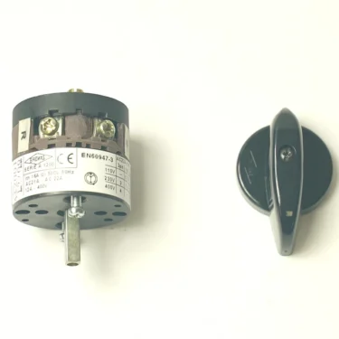 A rotary switch with a metal shaft and labeled terminals is on the left, its black plastic knob and a DISCONTINUED Faema Rubber O-Ring 10.78x2.62mm are on the right, all displayed against a white background. © 2025 1st-line.com