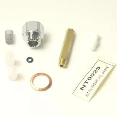 Assorted metal and plastic plumbing parts, including a hex connector, mesh filter, rubber O-ring, copper washer, white caps, and a tag labeled F.2451 PULSER FILTER KIT, displayed on a white surface. © 2025 1st-line.com