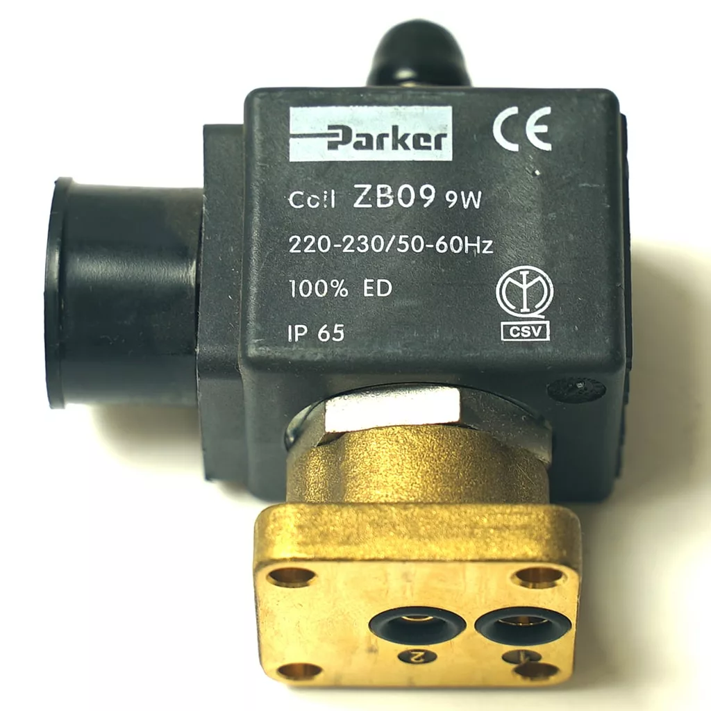 Close-up of a Faema 3-WAY 230V/9W PARKER RUBY solenoid valve coil with visible product labels, 230V specs, and IP65 rating; features brass and black plastic parts—compatible with Faema coffee machines. © 2025 1st-line.com