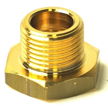 Close-up view of the I.2820 LOW PROFILE COUPLING FITTING, a shiny brass hexagonal threaded fitting often used in plumbing and industrial applications. © 2025 1st-line.com