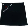 The Elektra 06385035 Microfiber Cloth is black and rectangular with a silver grommet in the top left corner. ELEKTRA in white and a small red logo are printed diagonally near the top left edge. © 2025 1st-line.com