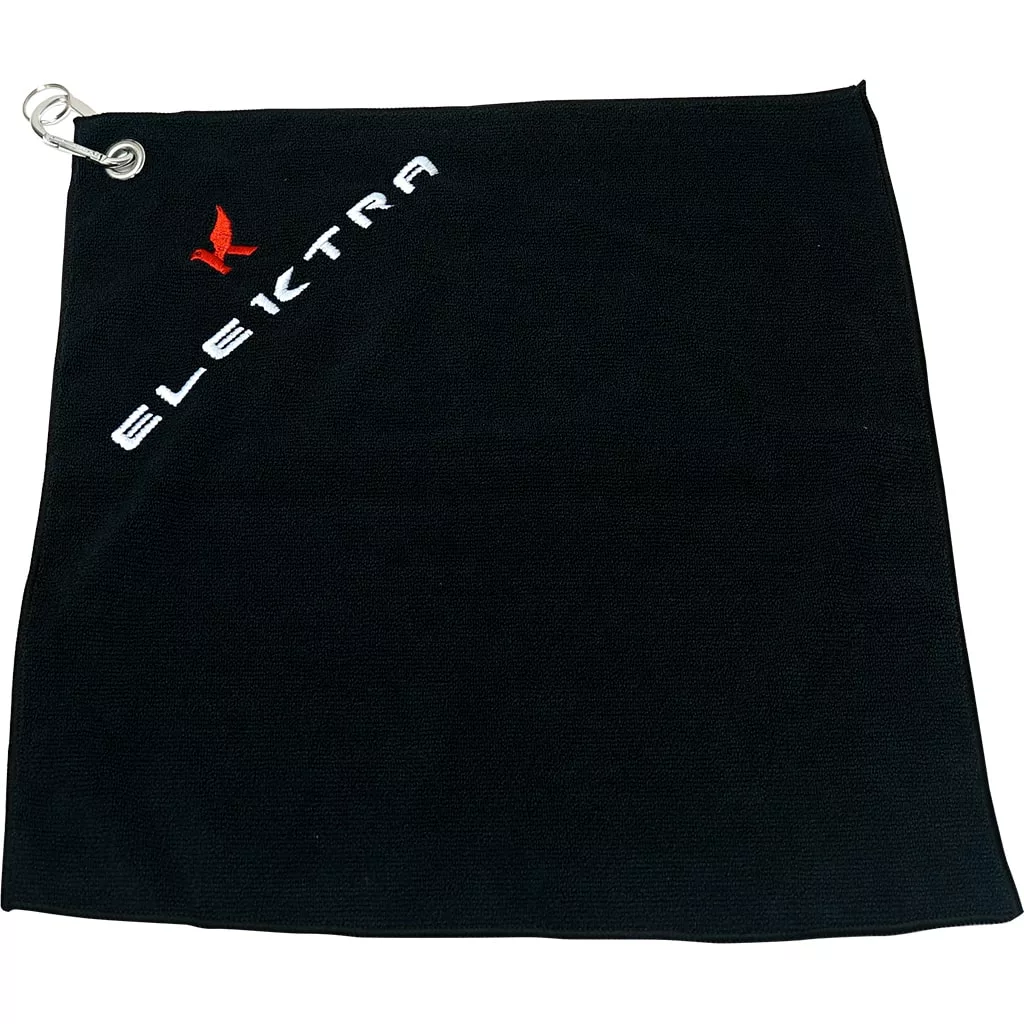 The Elektra 06385035 Microfiber Cloth is black and rectangular with a silver grommet in the top left corner. ELEKTRA in white and a small red logo are printed diagonally near the top left edge. © 2025 1st-line.com