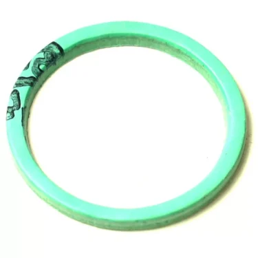 The F.1181 ALIMENTARY GASKET 36x30x2mm is mint green and circular, featuring a small black pattern on one side, set against a white background. © 2025 1st-line.com