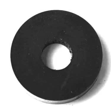 The F...55 INLET TAP SPRING 8x20mm is a round, flat black washer with a central hole, perfect for inlet tap fittings. © 2025 1st-line.com