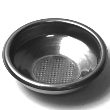 The G..361 7gr FILTER 1-CUP is a stainless steel portafilter basket with tiny bottom holes, designed to hold ground coffee in an espresso machine, shown on a plain white background. © 2025 1st-line.com