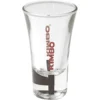 The Kimbo Dublino Shot Glass - 2oz is a clear glass with KIMBO printed vertically in red, featuring a thick base and a gently flared rim. © 2025 1st-line.com