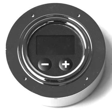 The Lelit 9600071 Kate LCC Display (Cod 9.3.01.22G01) is a round electronic control panel featuring a compact display, two large plus and minus buttons, all set in a shiny metallic frame against a white background. © 2025 1st-line.com