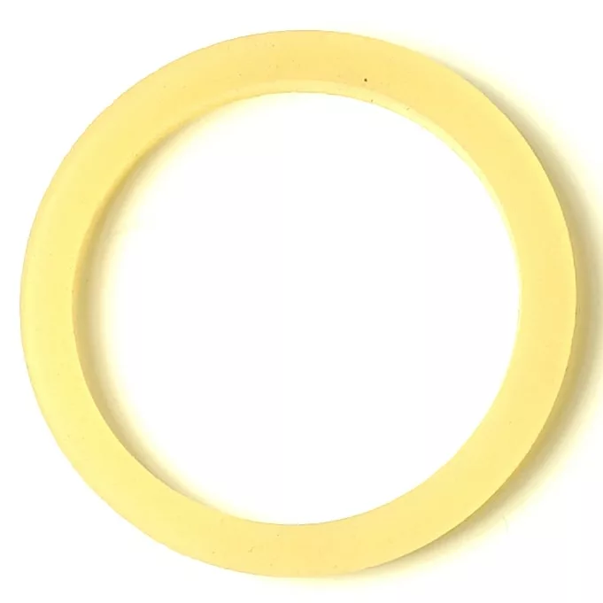 The LT..23 SILICONE PORTAFILTER GASKET 63.3x50.2x6mm is thin, flat, and pale yellow with a smooth texture, displayed on a white background. © 2025 1st-line.com