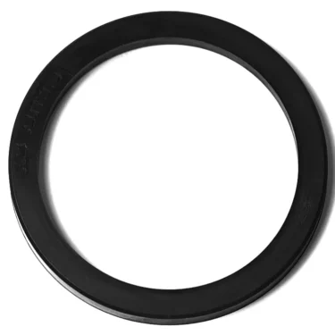 The M..293 PORTAFILTER GASKET 65x53x5mm is a black, flat, circular gasket with a smooth surface, shown against a white background. © 2025 1st-line.com