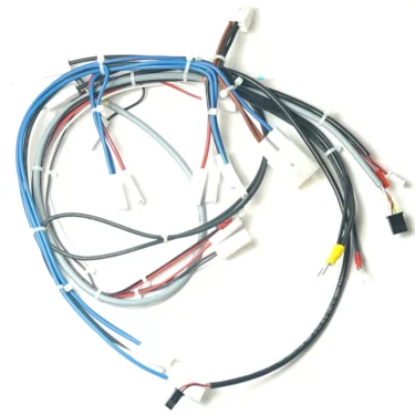 The VBM ELETCOMCABDJDGW JUNIOR DIGITAL WIRING ASSEMBLY features multicolored wires, multiple white plastic connectors, and zip ties, all arranged on a white background. © 2025 1st-line.com