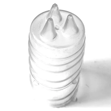 The VBM ELETCUFCOM SWITCH COVERING, with its clear plastic body and three pointed nozzle tips, stands upright on a white background, mirroring the precise design of a pastry bag coupler. © 2025 1st-line.com