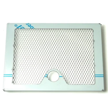 The VBM GRIGCASDJUNV3 Junior Drip Tray Grid (new style) features a rectangular metallic design, honeycomb mesh pattern, blue stripes on white, and a circular cutout near the bottom edge. © 2025 1st-line.com