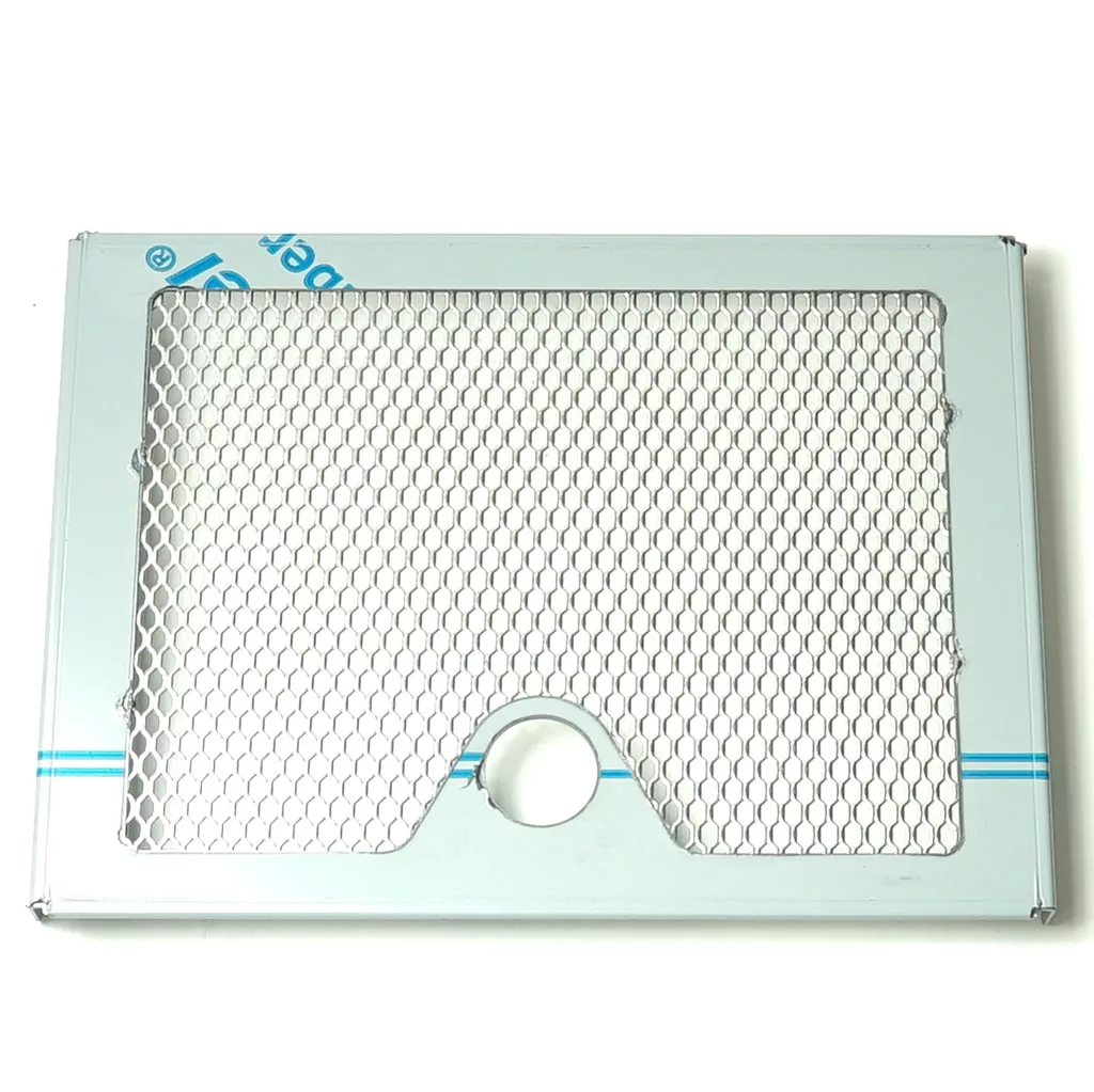 The VBM GRIGCASDJUNV3 Junior Drip Tray Grid (new style) features a rectangular metallic design, honeycomb mesh pattern, blue stripes on white, and a circular cutout near the bottom edge. © 2025 1st-line.com