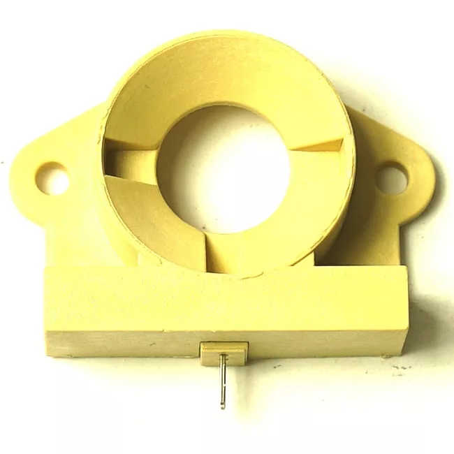 The VBM MATECVAASENSORENW WATER TANK SENSOR is a yellow plastic mounting bracket with a central circular opening, two side screw holes, and a bottom metal pin—perfect for water tank sensor applications. © 2025 1st-line.com