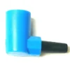 The VBM RACCMATECVAACDONW Water Tank Connector is a small plastic piece with a blue right-angled cylindrical body and a short black tapered nozzle, displayed against a white background. © 2025 1st-line.com