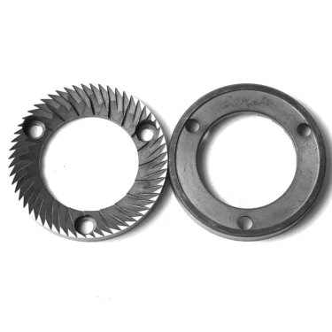 Two circular metal burrs for a coffee grinder are shown side by side on a white background. The left 60mm Eureka MAC60ITA CP Flat Burr Set has angled sharp teeth, while the right is smooth and engraved with Eureka. © 2025 1st-line.com