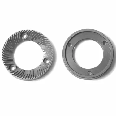 Two Rossi MC..66 GRINDING BURRS for coffee grinders are displayed on a white background; the left burr features angled sharp ridges, while the right one is flat with a smooth inner ring. © 2025 1st-line.com