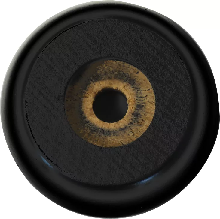 A close-up of a single Lelit 4100011 Black Wood Foot button, featuring a tan and black circular pattern in the center and a single hole. © 2025 1st-line.com