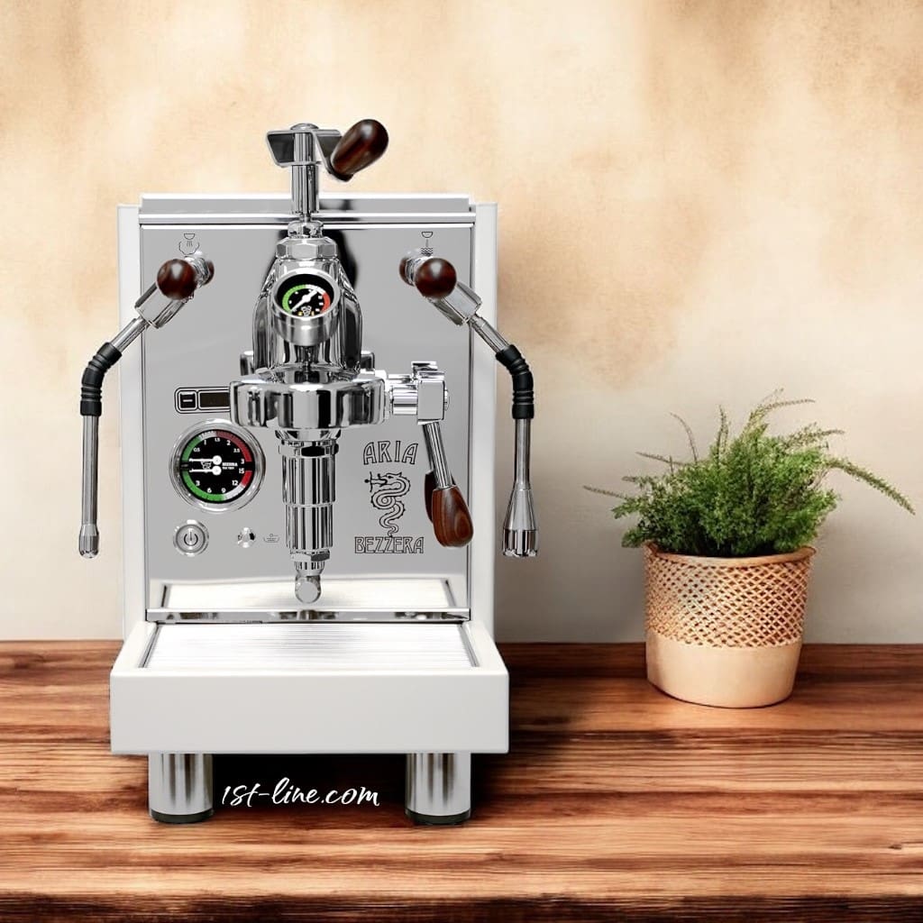 A Bezzera Aria HX Special Edition Espresso Machine w/ Flow Control, featuring polished chrome and wooden handles, sits on a countertop beside a potted green plant in a woven basket against a beige textured wall. © 2025 1st-line.com