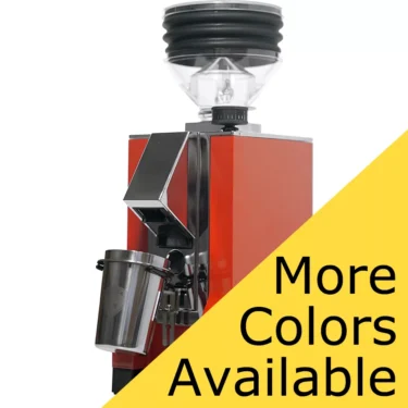 A red Eureka Mignon Zero Espresso Coffee Grinder with a metal container stands against a white background. A large yellow triangle in the bottom right corner displays More Colors Available in bold black letters. © 2025 1st-line.com