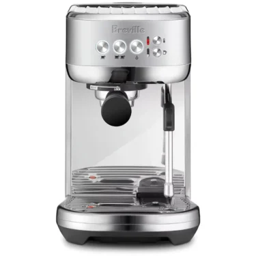 The Breville Bambino Plus™ Espresso Machine in stainless steel, with front buttons, knob, central portafilter, and right-side steam wand, shown against a white background. © 2025 1st-line.com