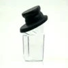 The Fiorenzato 900000996/R Cup (Complete) is a clear glass container with a slanted black lid, featuring an angular, modern design that stands upright against a plain white background—ideal for contemporary spaces. © 2025 1st-line.com
