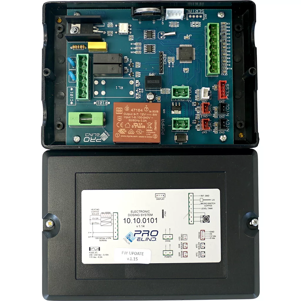 The VBM ELETDOSDOSUJUDIGIT Brain Unit features an electronic circuit board in a black plastic enclosure, with visible relays, connectors, and terminals; the lower lid displays a product label with technical details and branding. © 2025 1st-line.com