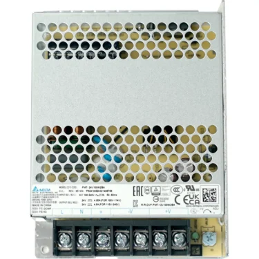 The VBM ELETSWITCHDOM Brain Unit power supply comes in a metal case with a perforated top, labeled terminal screws (L, N, -, V, +), certification symbols, and detailed specs listed on the label beneath the unit. © 2025 1st-line.com