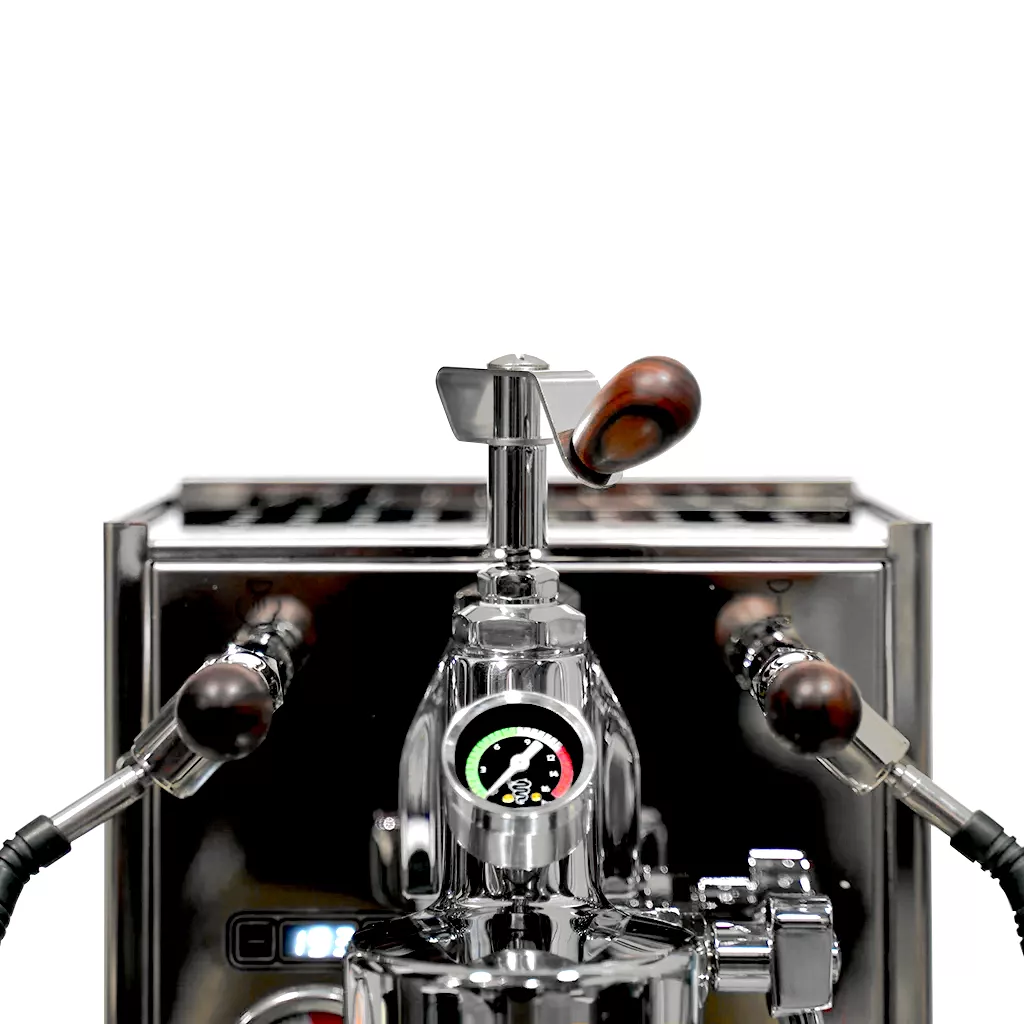 A close-up of the Bezzera E61 Grouphead Espresso Machine with Flow Control, featuring a polished chrome finish, two wooden-handled steam wands, and a central pressure gauge, set against a white background. © 2025 1st-line.com
