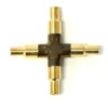 A metallic gold Lelit 2200110 4-Way Cross Fitting with four cylindrical connectors extending from the center, shown on a white background. © 2025 1st-line.com