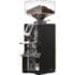 A modern Eureka Mignon Libra espresso coffee grinder with a digital display, filled with coffee beans in a transparent hopper on top, and a metal spout for dispensing weight-based ground coffee at the front. © 2025 1st-line.com