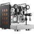 A stainless steel Rocket Appartamento espresso machine with black side panels featuring circular copper accents, various knobs, a pressure gauge, and a steam wand—an elegant TCA HX model for true coffee enthusiasts. © 2025 1st-line.com