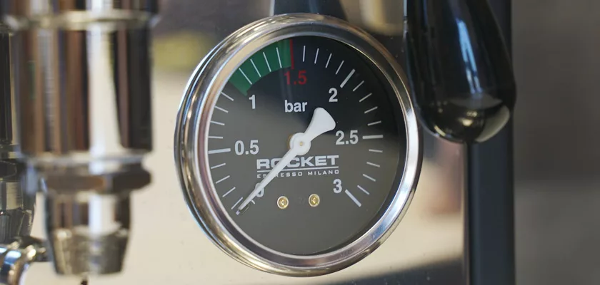 Close-up of a pressure gauge on the Rocket Appartamento TCA HX Espresso Machine, showing 0–3 bars with the needle just below 1 bar and a reflective metallic rim. © 2025 1st-line.com