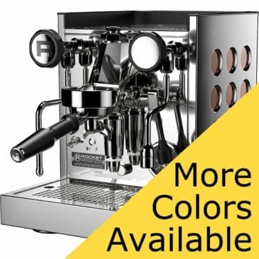 The Rocket Appartamento TCA HX Espresso Machine, made of shiny stainless steel with a portafilter and steam wand, is shown at an angle. A yellow overlay in the corner reads More Colors Available in black text. © 2025 1st-line.com