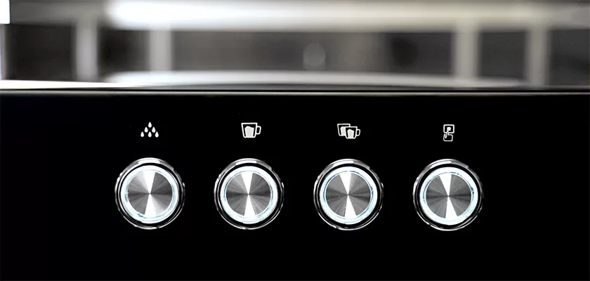 Close-up of four metallic buttons on the Bellezza Bellona Dual Boiler Espresso Machine control panel, each topped with an icon for water, single cup, double cup, and possibly steam or milk functions. © 2025 1st-line.com