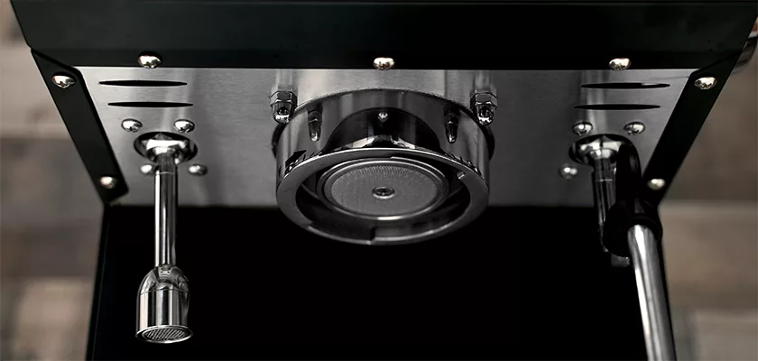 Close-up of the underside of the Bellezza Bellona Dual Boiler Espresso Machine, featuring a central group head, steam wand to the left, and hot water spout on the right—all in stainless steel. © 2025 1st-line.com